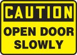 Safety Sign, Header: CAUTION, Legend: OPEN DOOR SLOWLY