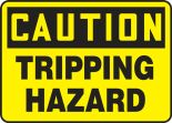 Safety Sign, Header: CAUTION, Legend: TRIPPING HAZARD