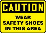 Safety Sign, Header: CAUTION, Legend: WEAR SAFETY SHOES IN THIS AREA