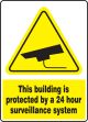 THIS BUILDING IS PROTECTED BY A 24 HOUR SURVEILLANCE SYSTEM W/GRPAPHIC