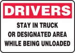 DRIVERS STAY IN TRUCK OR DESIGNATED AREA WHILE BEING UNLOADED