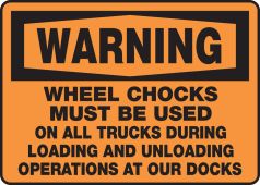 OSHA Warning Safety Sign: Wheel Chocks Must Be Used On All Trucks During Loading And Unloading Operations At Our Docks