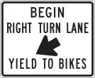BEGIN RIGHT TURN LANE (ARROW DOWN RIGHT) YIELD TO BIKES