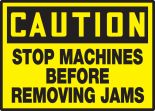 STOP MACHINES BEFORE REMOVING JAMS
