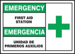Safety Label, Header: EMERGENCY/EMERGENCIA, Legend: FIRST AID STATION (W/GRAPHIC) (BILINGUAL)
