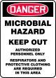 MICROBIAL HAZARD KEEP OUT AUTHORIZED PERSONNEL ONLY RESPIRATORS AND PROTECTIVE CLOTHING ARE REQUIRED IN THIS AREA