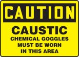 CAUSTIC CHEMICAL GOGGLES MUST BE WORN IN THIS AREA