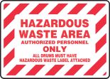 AUTHORIZED PERSONNEL ONLY ALL DRUMS MUST HAVE HAZARDOUS WASTE LABEL ATTACHED