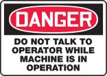 DO NOT TALK TO OPERATOR WHILE MACHINE IS IN OPERATION