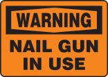 NAIL GUN IN USE