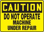 DO NOT OPERATE MACHINE UNDER REPAIR