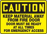 KEEP MATERIAL AWAY FROM FIRE DOOR DOOR MUST BE READY AT ALL TIMES FOR EMERGENCY ACCESS