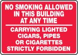 NO SMOKING ALLOWED IN THIS BUILDING AT ANY TIME CARRYING LIGHTED CIGARS, PIPES OR CIGARETTES STRICTLY FORBIDDEN