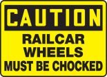 RAILCAR WHEELS MUST BE CHOCKED