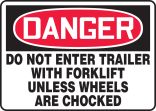DO NOT ENTER TRAILER WITH FORKLIFT UNLESS WHEELS ARE CHOCKED