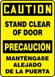 CAUTION STAND CLEAR OF DOOR (BILINGUAL SPANISH)