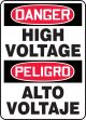 bilingual safety signs with the message high voltage
