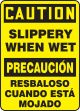 CAUTION SLIPPERY WHEN WET (BILINGUAL- SPANISH)