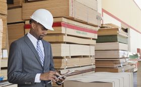 Fines For OSHA hero image. man with tablet