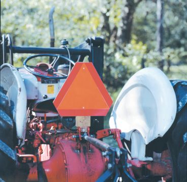 slow moving vehicle sign mounted on a tractor