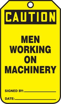 MEN WORKING ON MACHINERY