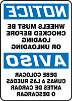 NOTICE WHEELS MUST BE CHOCKED BEFORE LOADING OR UNLOADING (BACKWARDS) (BILINGUAL SPANISH)
