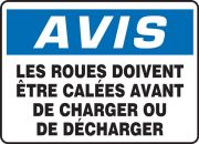 Safety Sign, Header: NOTICE, Legend: NOTICE WHEELS MUST BE CHOCKED BEFORE LOADING OR UNLOADING