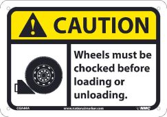 CAUTION, WHEELS MUST BE CHOCKED BEFORE LOADING OR. . .