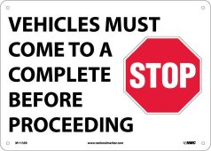 VEHICLES MUST COME TO A COMPLETE STOP BEFORE PROCEEDING SIGN