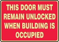 Glow-In-The-Dark Safety Sign: This Door Must Remain Unlocked When Building Is Occupied (Red Background)