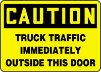 OSHA Caution Safety Sign: Truck Traffic Immediately Outside This Door