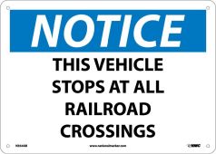 NOTICE THIS VEHICLE STOPS AT ALL RAILROAD CROSSINGS SIGN